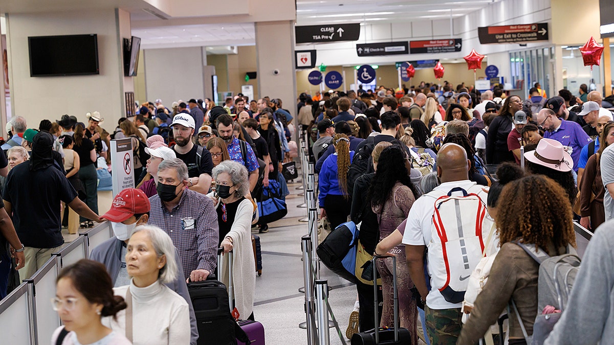 Airport passengers in long TSA wait lines — agents unpaid