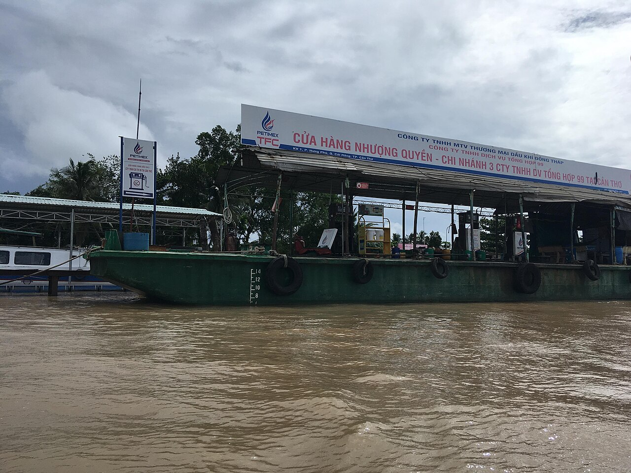 Vietnamese gas station displaying new fuel prices after the triple tax cut